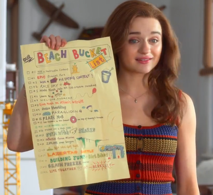 Elle holding the beach bucket list the kissing booth